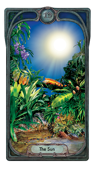 The Tarot card for The Sun features a lush tropical landscape with abundant plants and reptiles basking in the warmth.