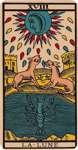 The Moon Tarot card showing a wolf and a dog howling at a full moon with a face looking down. Two towers flank the landscape and a crayfish stands vertically in a pool in the foreground. Droplets of blue, red and yellow emanate from the moon.