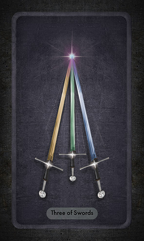 The Three of Swords shows three swords, gold, blue and green, in a triangular arrangement with their tips touching in a point of light.
