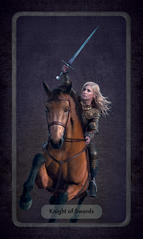 The Knight of Swords shows a young woman galloping on a horse with a raised sword in her right hand.
