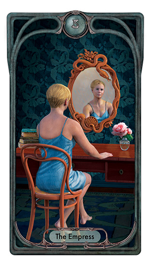 The Empress wears a blue slip and sits before a vanity table stacked with books on one side and a vase of pink peonies on the other. Her back is to us and we see her through her reflection in a wooden Art Nouveau-style mirror entwined with carved snakes.